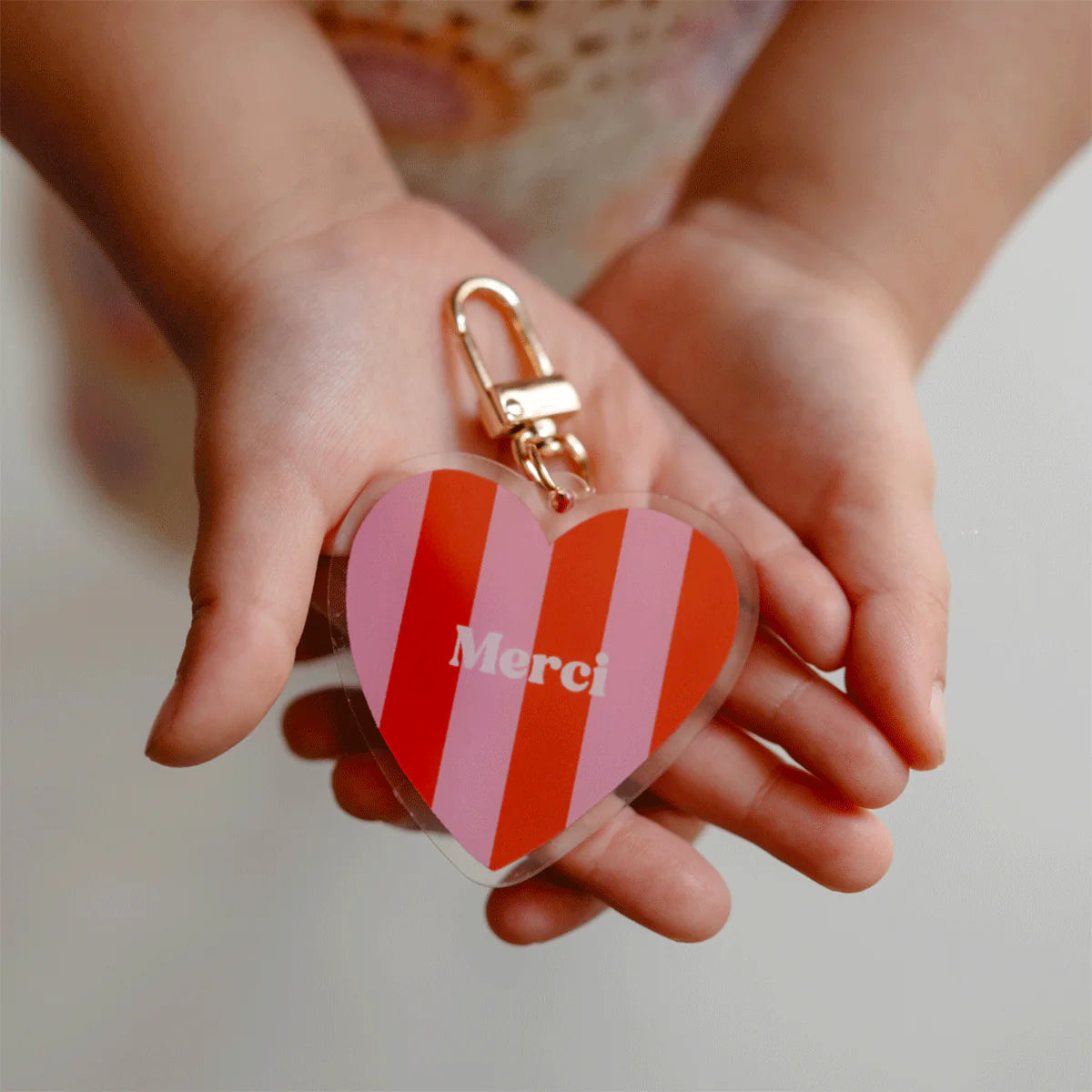 Porte-clés rayé "Merci"